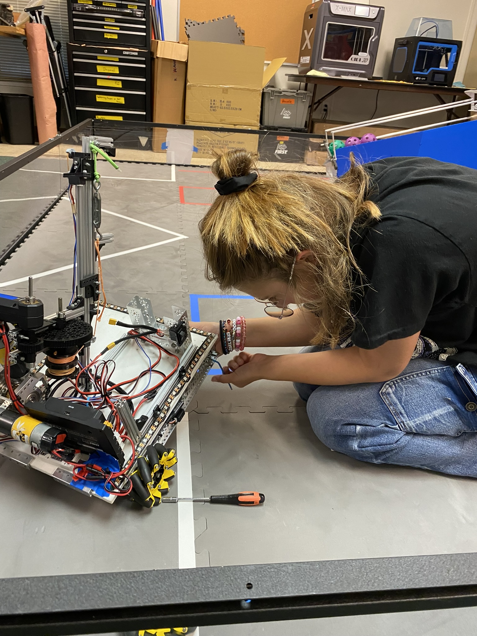 Team posing with robot during build