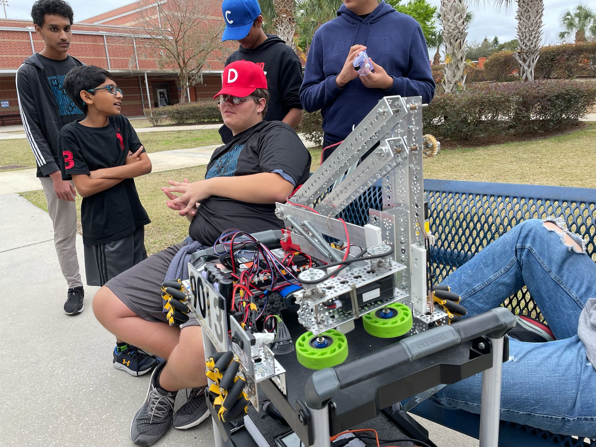 Coach reviewing match footage with students